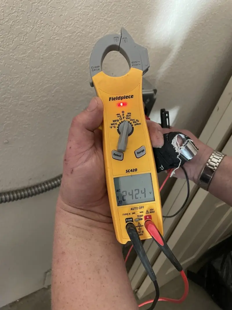 Voltage testing with clamp meter during Circuit Breaker Repair in Hartselle